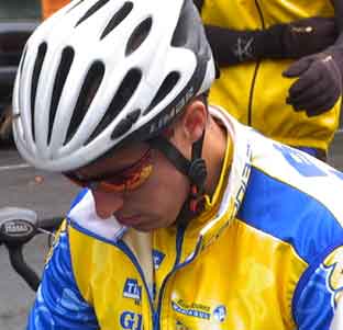 John Mackenzie in cycling kit and helmet